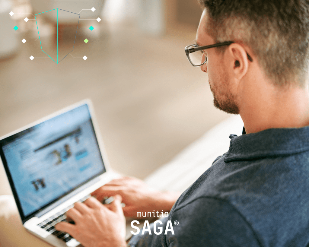 Man using a laptop with a blurred website on screen and a digital shield overlay, representing real-time analysis of how do you report a website in cybersecurity.