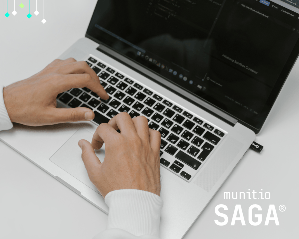 Hands typing on a laptop displaying a dark-mode development interface, representing cybersecurity tasks and raising the question: is accessing the dark web illegal for professionals engaged in threat analysis or ethical research?