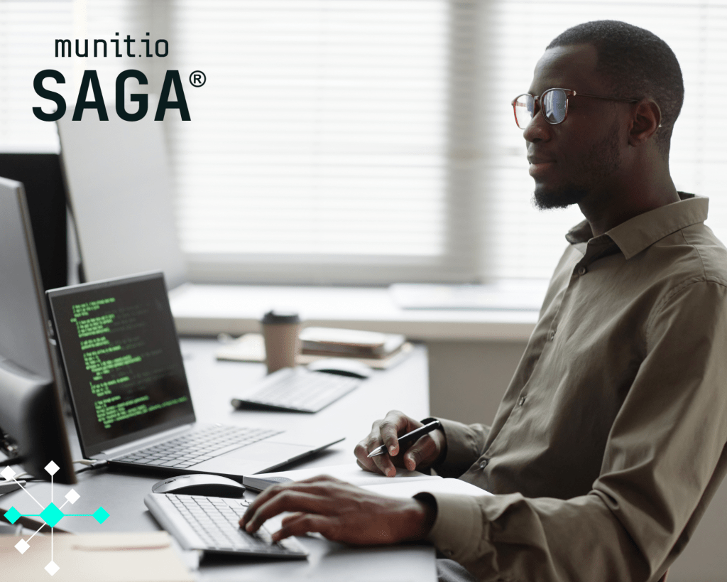 A cybersecurity professional works at a desk with dual monitors displaying code, exemplifying what do you do in cyber security through real-time threat analysis and system monitoring.