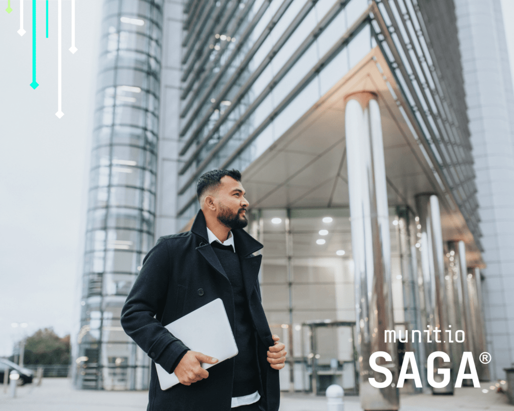 Business professional walking outside a modern office building holding a laptop, reflecting a proactive approach to protecting your brand in corporate environments.