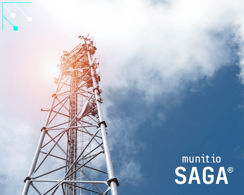 Telecommunication tower against a blue sky representing critical infrastructure at risk from the hacktivism cyber threat.