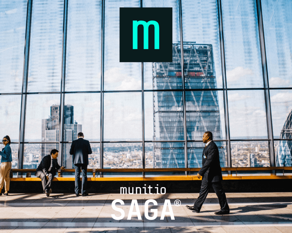 Business professionals are seen in a high-rise building with panoramic city views, emphasizing the corporate environments where understanding what is executive security becomes critical for safeguarding leadership and infrastructure.