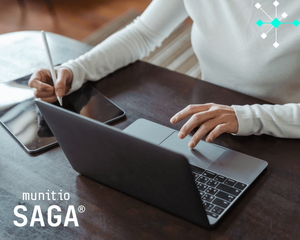 A professional works across a laptop and tablet, managing sensitive digital tasks—demonstrating a practical context for what is executive security in protecting leadership communications and assets.