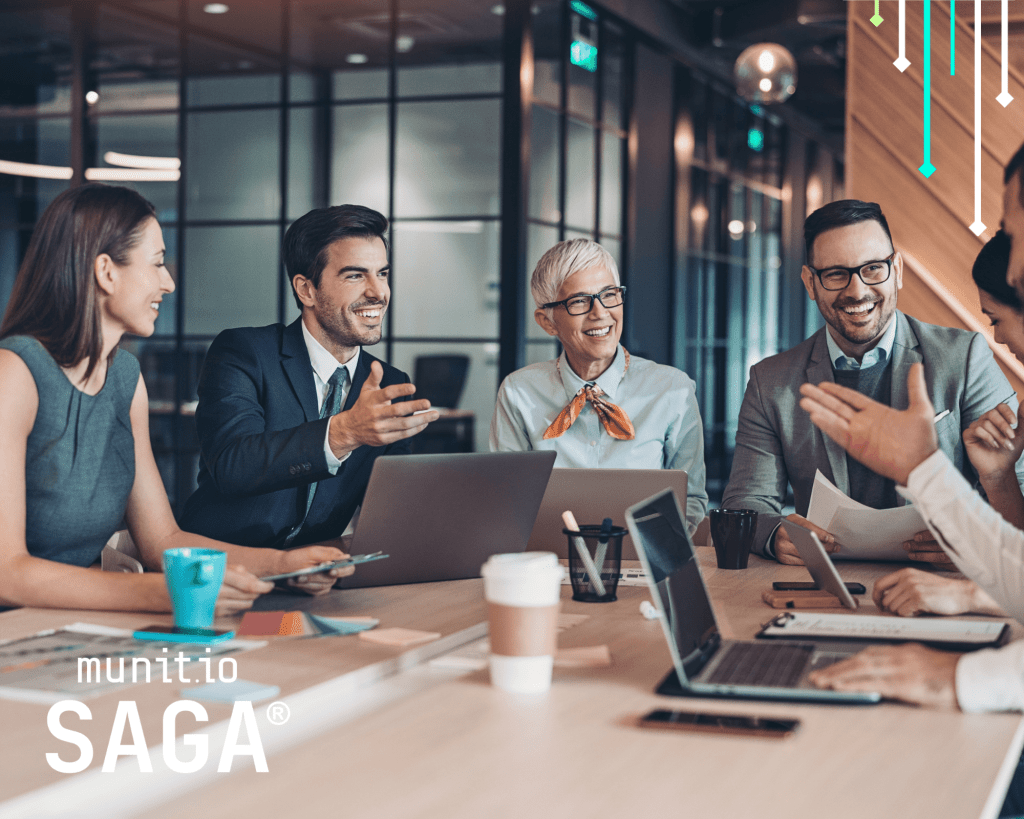 Business professionals collaborating around laptops in a modern office emphasize how dark web monitoring supports informed decision-making and strengthens organizational cybersecurity strategies.