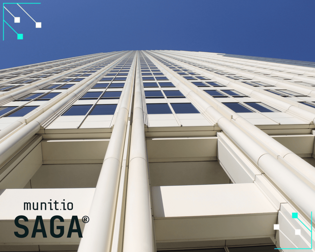 A tall corporate building against a clear sky, symbolizing how external attack surface monitoring helps organizations secure their expanding digital infrastructure.