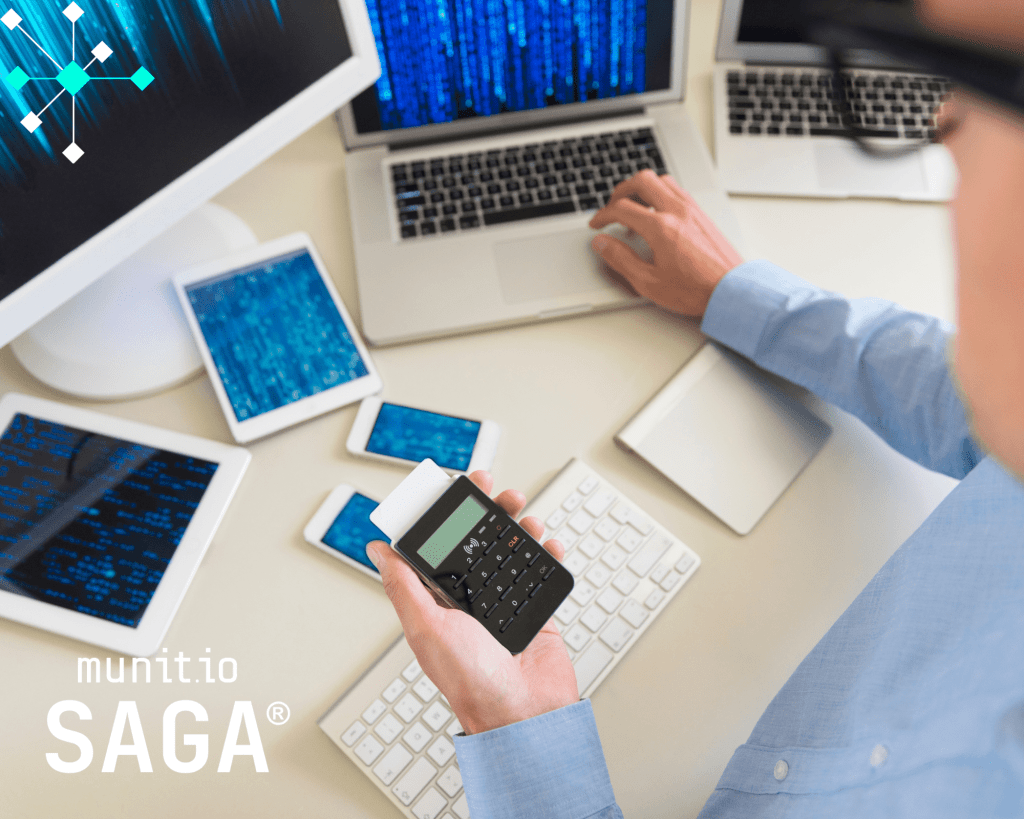 Business professional working with multiple devices and digital screens, illustrating how third-party risk monitoring helps protect financial transactions and sensitive data.