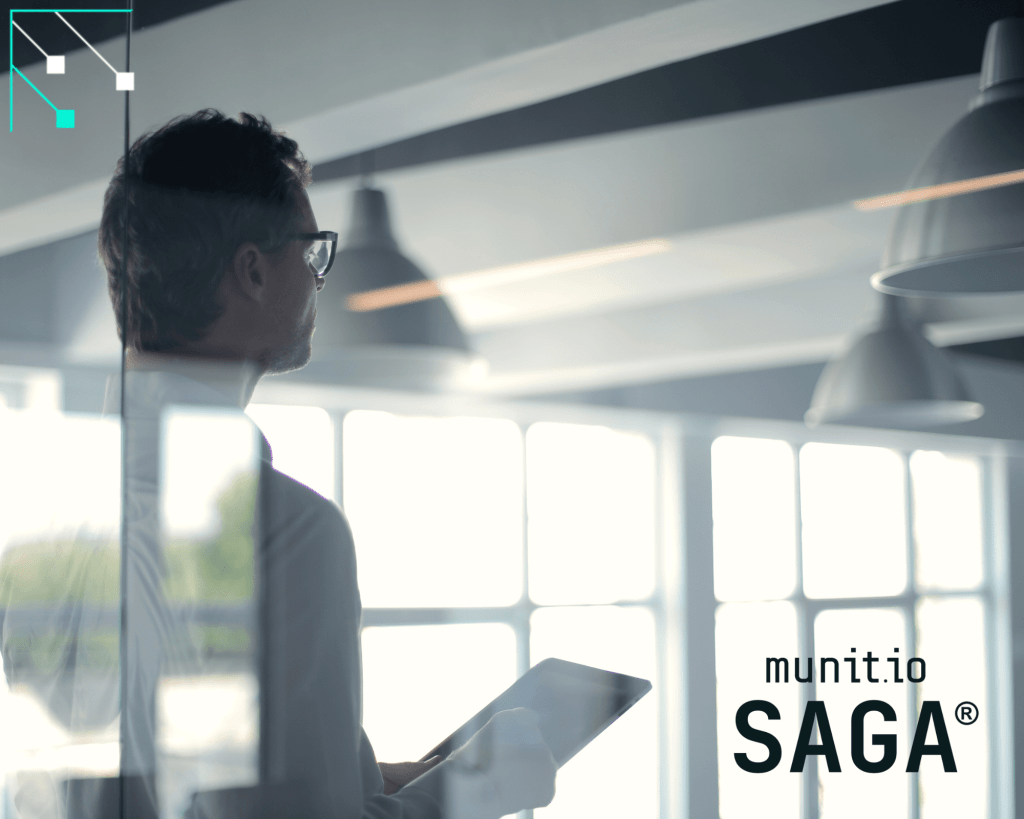 A business professional holding a tablet in a modern office highlights the importance of dark web monitoring for gaining visibility into hidden threats and safeguarding organizational data.