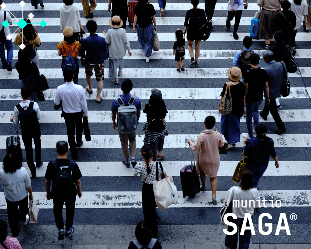 Crowd of people crossing a city street, symbolizing the diverse organizations that can benefit from the NIS2 compliance checklist for SMEs.