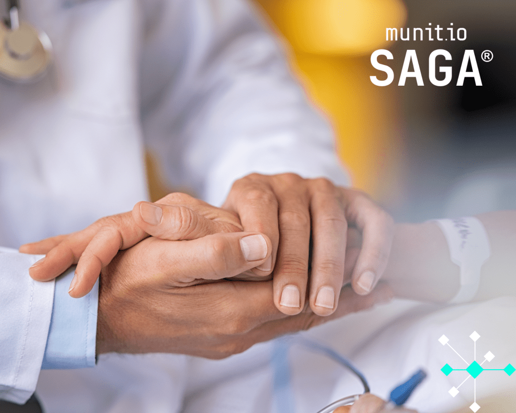 A doctor holding a patient’s hand in a hospital setting, representing trust and protection supported by dark web intelligence for healthcare companies to keep sensitive patient data secure.