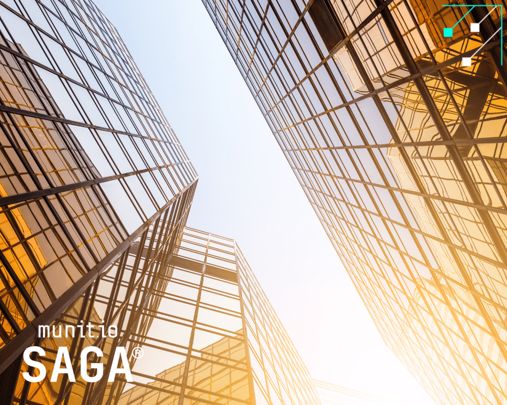 Tall glass corporate buildings seen from below, representing enterprise environments that rely on stolen password detection for businesses to prevent credential-based breaches across large organizations.