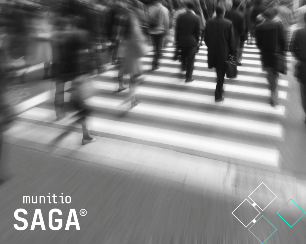 Crowd of business people walking across a city crosswalk in motion blur, symbolizing fragmented decision-making caused by a Market Intelligence Silo.