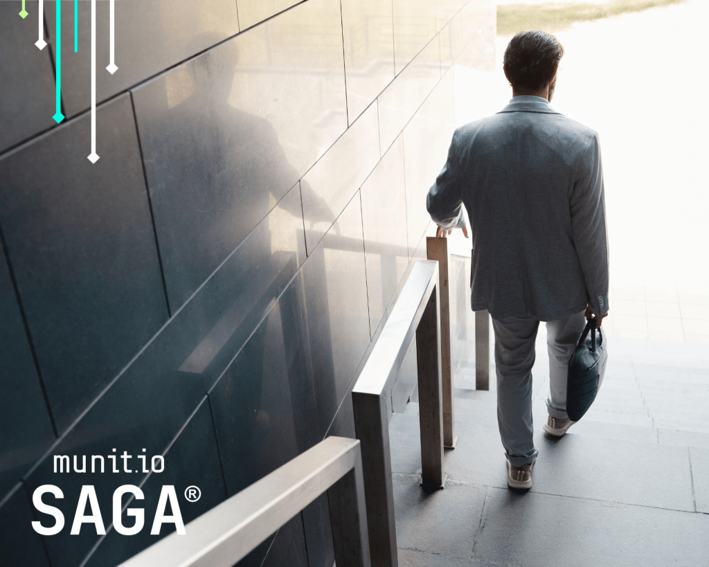A business professional walking downstairs with a briefcase, symbolizing proactive steps in understanding what is cyber exposure management and reducing digital risk visibility.