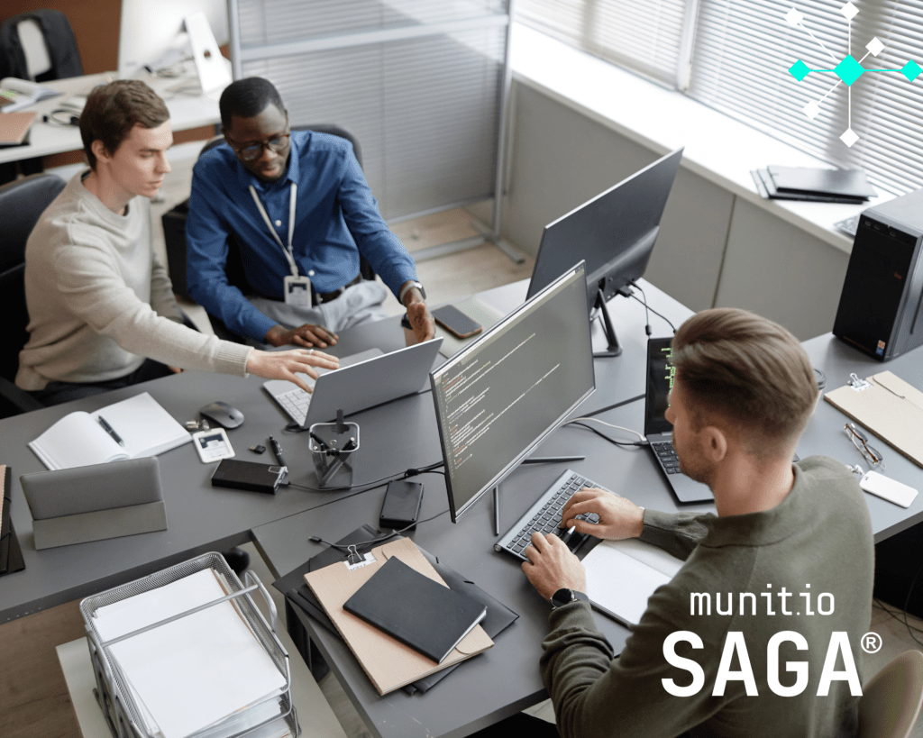 Cybersecurity professionals analysing code and threat data on multiple screens, illustrating the practical implications of What is ransomware-as-a-service for organisations defending against modern cyber extortion models.