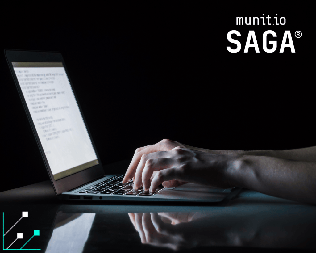 Hands typing on a laptop in a dark environment, illustrating how dark web marketplaces work and how cybercriminals operate through hidden networks and encrypted platforms.
