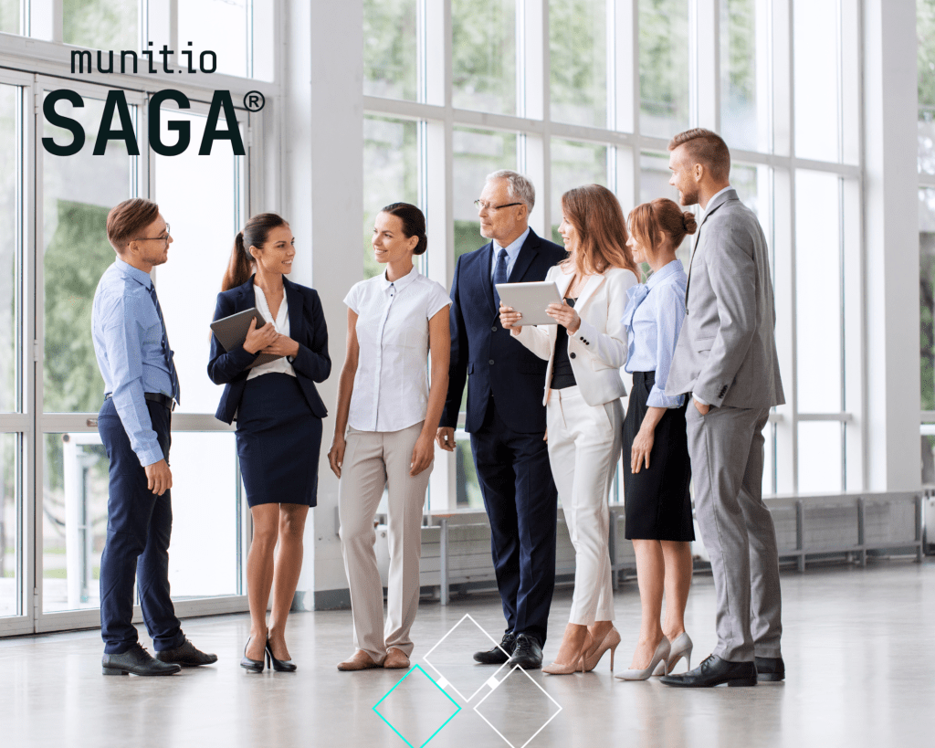 A group of business professionals standing together in a bright corporate hallway, illustrating executive collaboration and awareness around what is phishing domain monitoring as part of organisational security strategy.