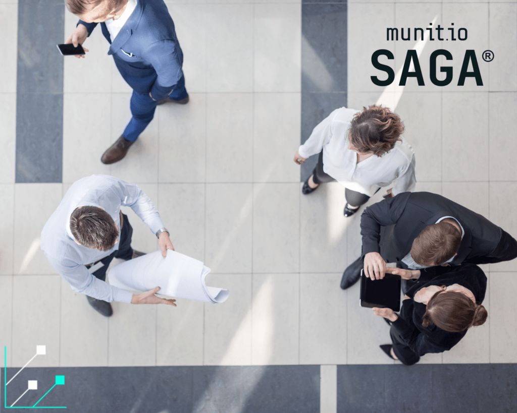 Executives reviewing documents and data together in a modern office setting, illustrating collaboration and strategic visibility—key aspects of understanding what is digital footprint analysis in cybersecurity.