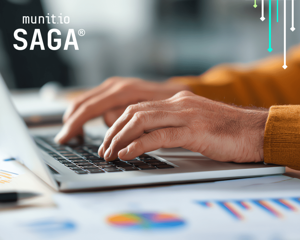 Hands typing on a laptop with analytical charts on the desk highlight the need for cybersecurity awareness and practical steps on How to detect fake online stores to protect customers and business assets.