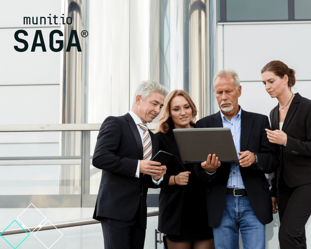 Business professionals reviewing information on a laptop outdoors, underscoring the importance of understanding What are initial access brokers and how they exploit system entry points sold on criminal marketplaces.