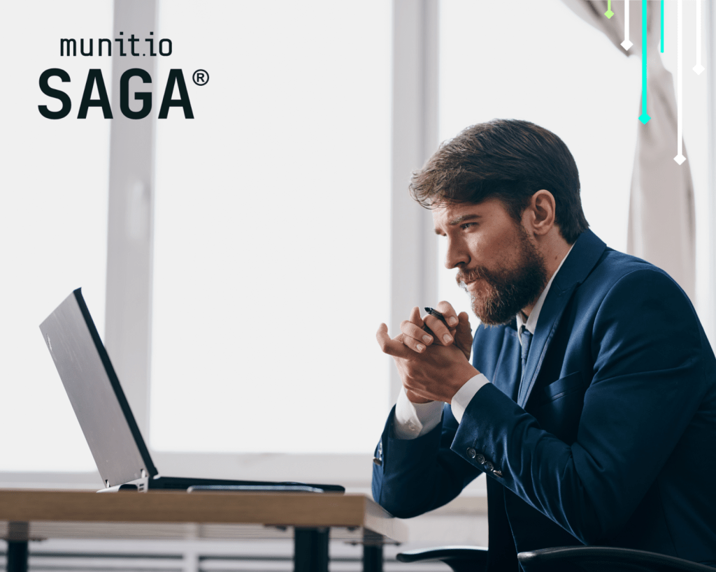 Business professional in a suit intently analyzing data on a laptop, illustrating How data brokers sell your information and highlighting the need for secure intelligence with munit.io SAGA.