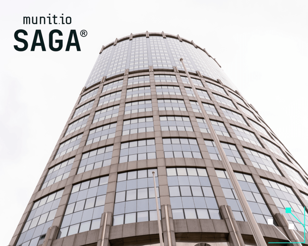 A tall corporate building with reflective glass windows, illustrating the scale of modern organisations that must understand what is doxxing to safeguard employees and sensitive information from targeted exposure.