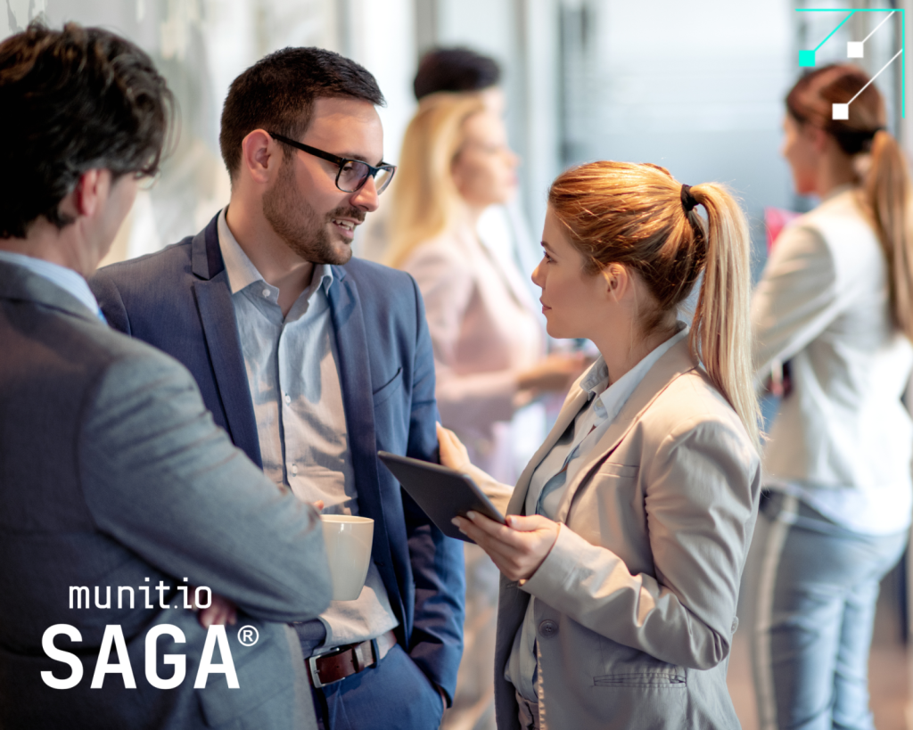 Groups of professionals exchanging information on digital devices, illustrating discussions relevant to the Types of data sold on the dark web and how such stolen data can impact organizations.