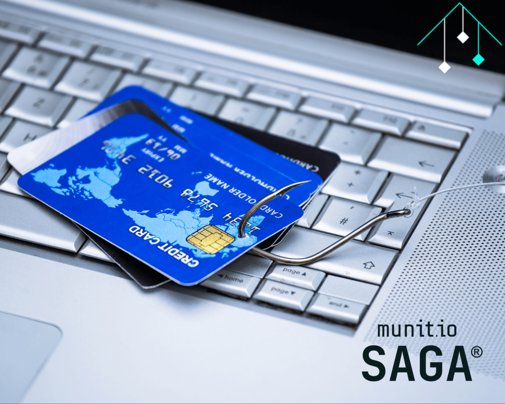 Credit cards pierced by a fishing hook resting on a laptop keyboard, visually representing credit card information leaked through phishing attacks and online fraud schemes.