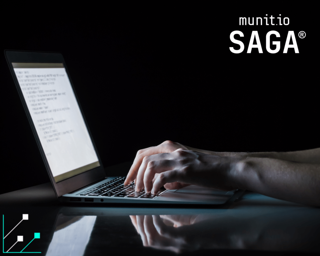 Hands typing on a laptop in a dark environment reflect what are infostealers by showing how malicious software captures keystrokes and sensitive data on a screen.