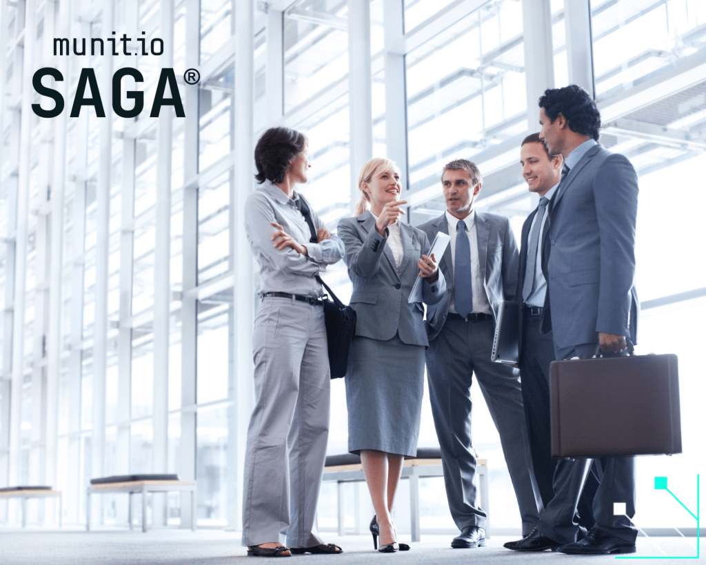 Business professionals discussing strategy in a modern office setting, highlighting how cybercriminals use AI to target organizations through social engineering and advanced digital deception.