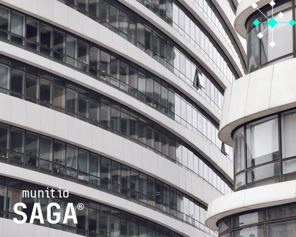 Modern glass office building with curved windows and multiple floors, reflecting digital environments where How to detect fake support accounts focuses on monitoring online platforms and suspicious activity across corporate systems.