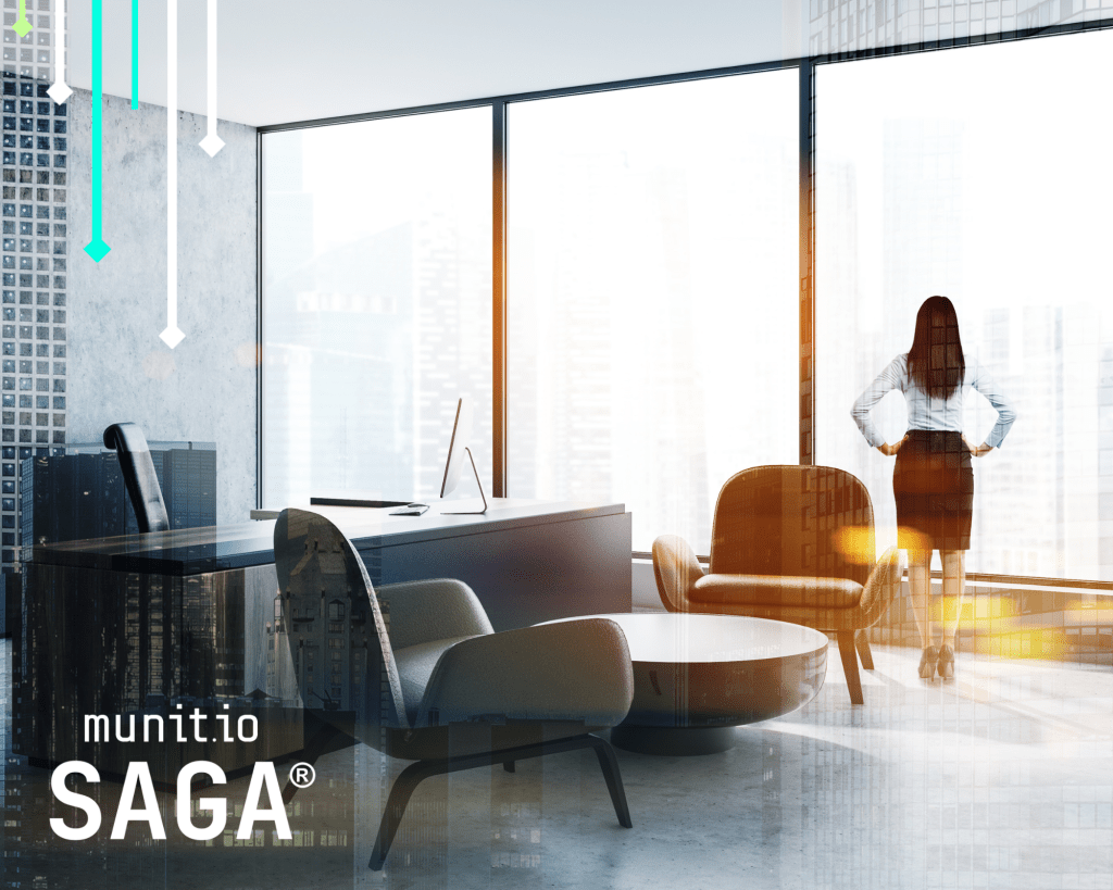 Brand abuse monitoring on social media is illustrated by a professional office scene with a woman standing by large windows overlooking a city, alongside desks, chairs, and a computer workstation symbolizing digital oversight and risk awareness.